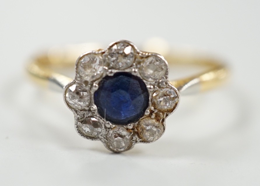 A mid 20th century 18ct & plat, sapphire and diamond set flower head cluster ring, size S, gross weight 2.8 grams.